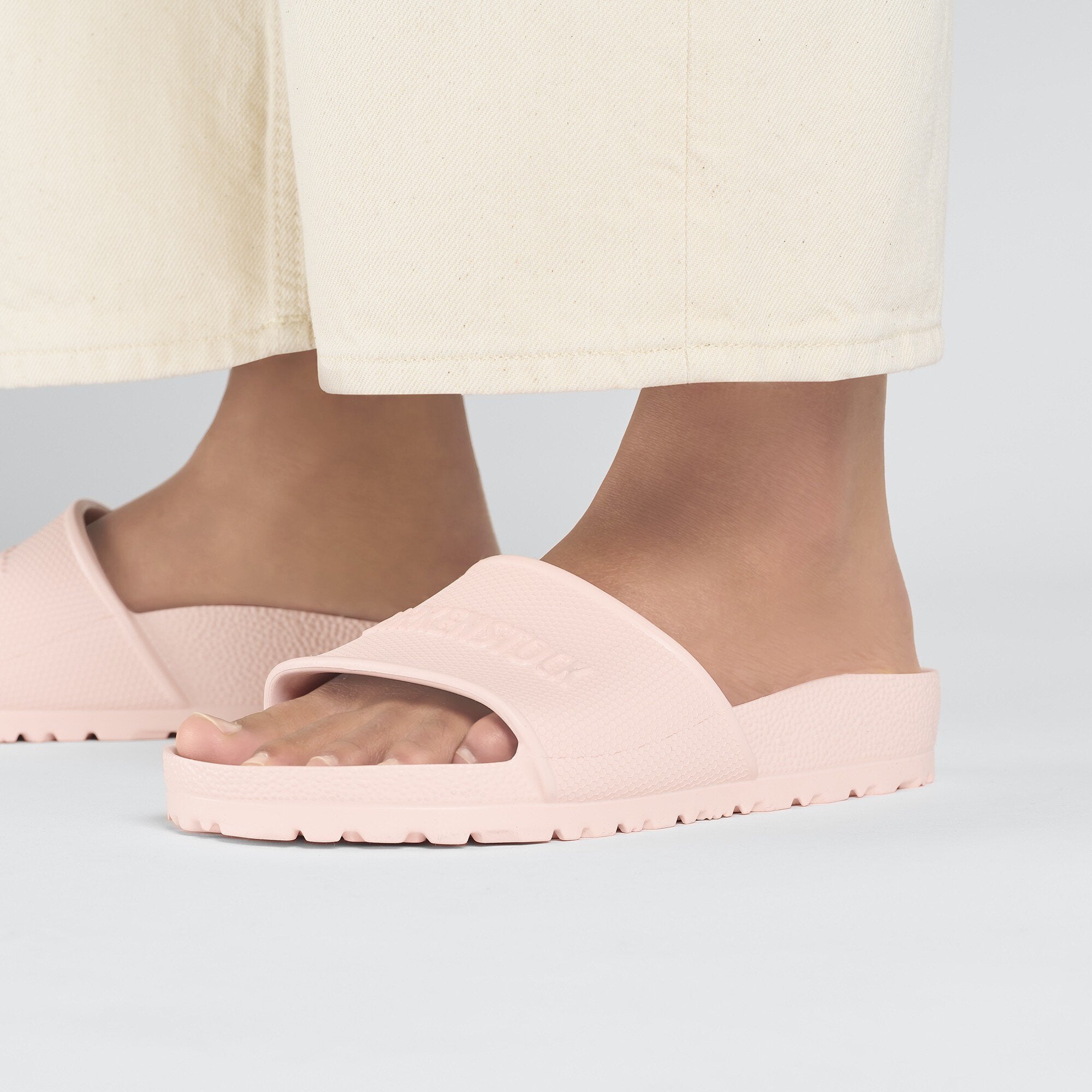 Birkenstock Barbados EVA slide sandals in light rose, showcasing water-friendly and flexible design.