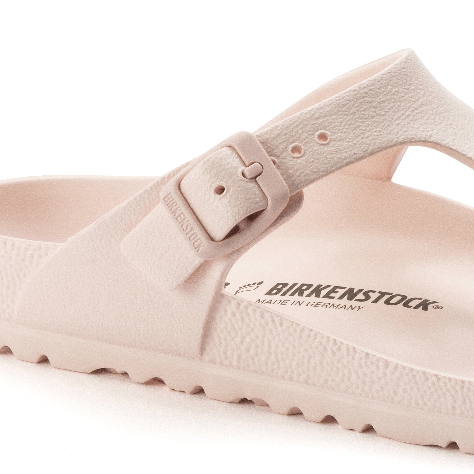 Close-up of Birkenstock Gizeh Essentials EVA sandal in Light Rose with adjustable buckle and footbed, made in Germany.