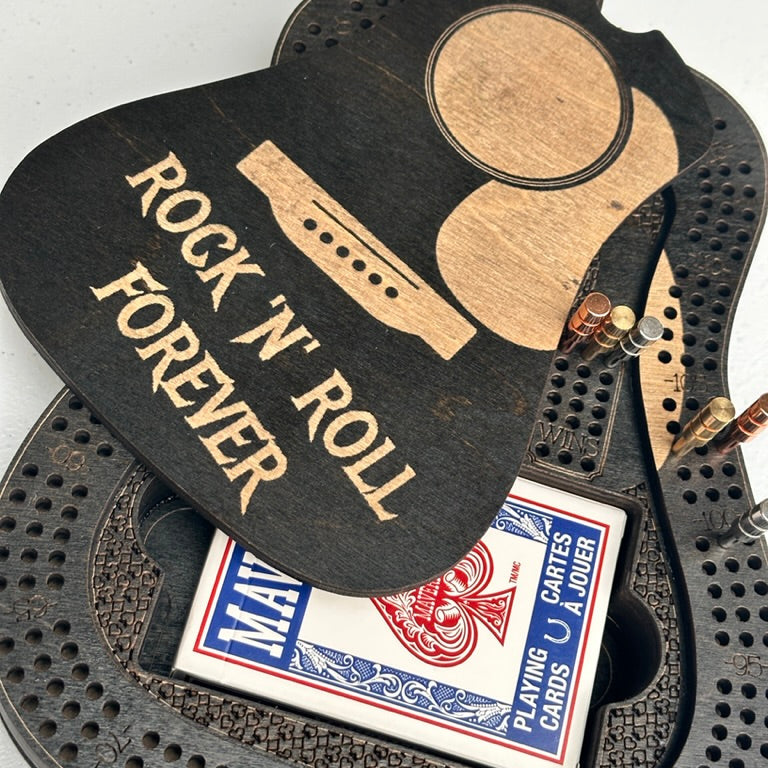 Guitar-shaped card holder with 'Rock 'n Roll Forever' text and a deck of cards inside.