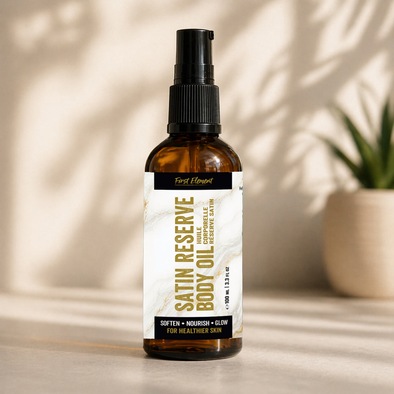 Bottle of Satin Reserve Body Oil on a neutral background