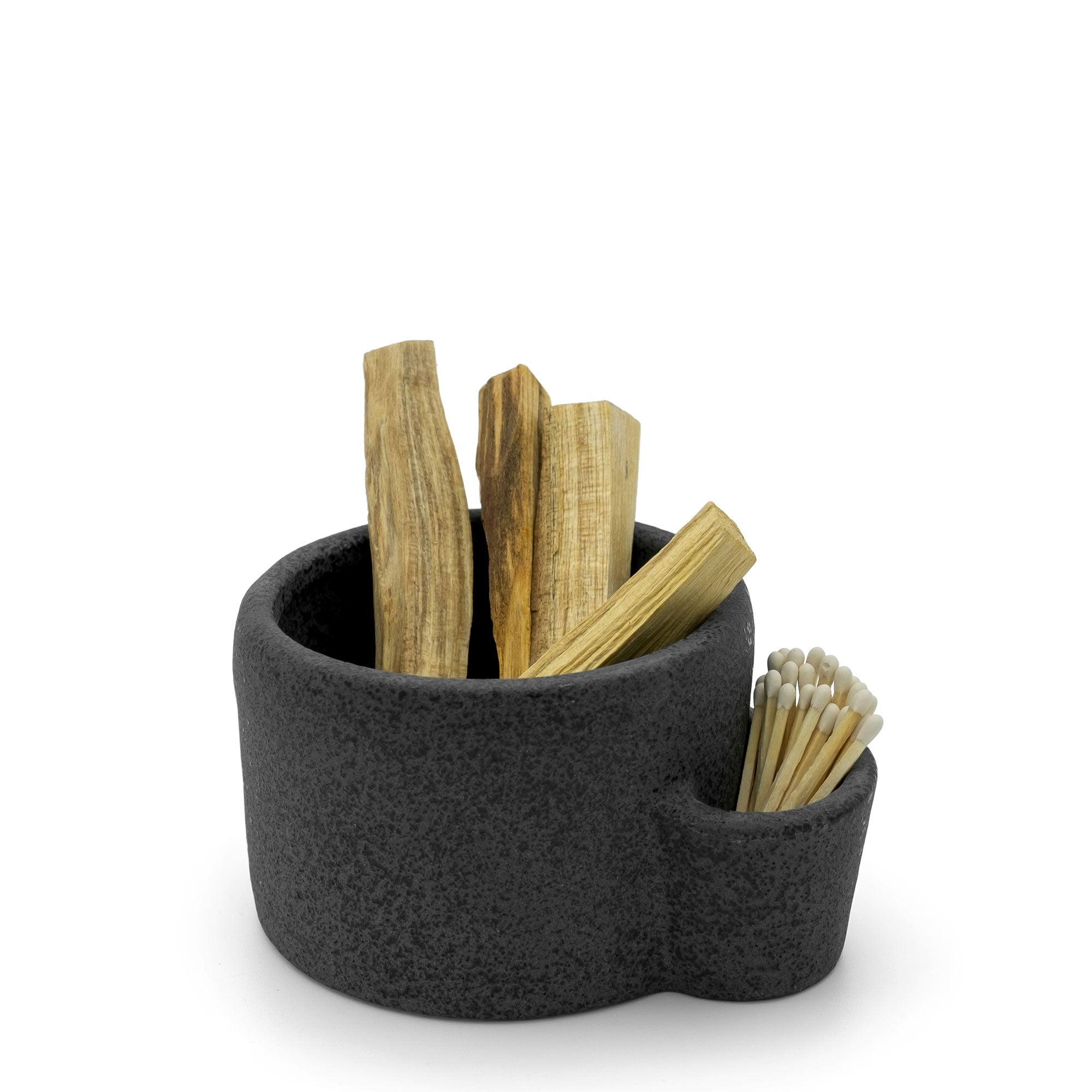 Black felt container with wooden sticks and toothpicks on a white background