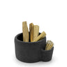 Black felt container with wooden sticks and toothpicks on a white background