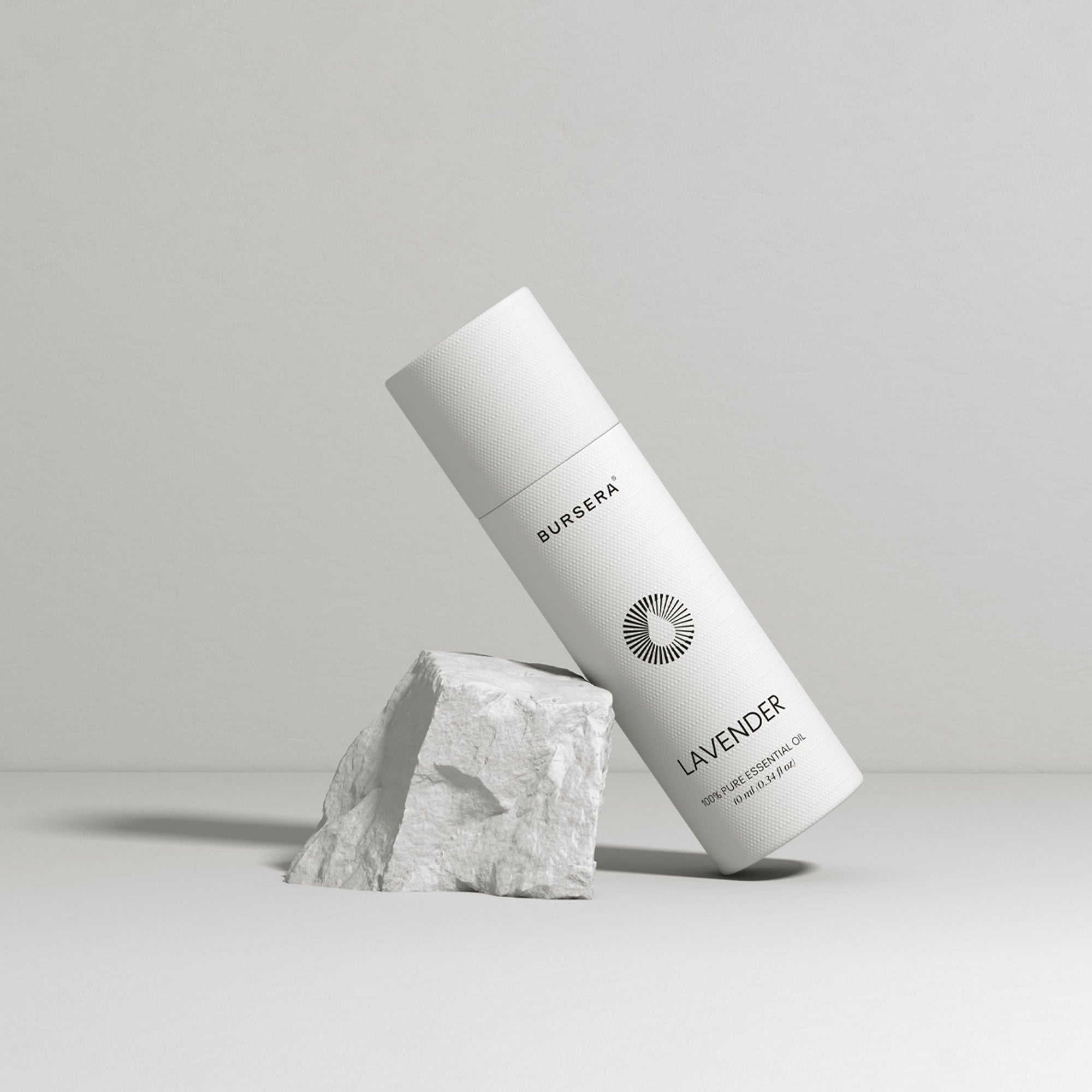 White skincare bottle labeled 'Lavender' on a gray background