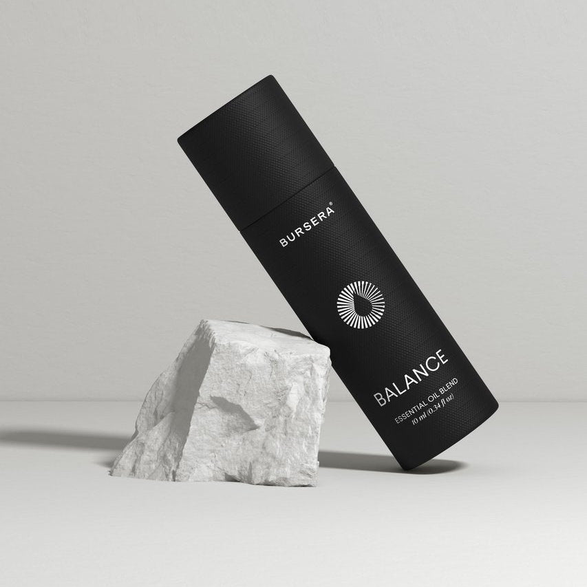 Black cylindrical product with 'Bursera' branding on a gray background