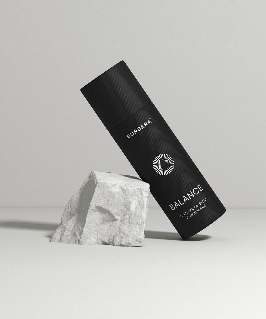Black cylindrical product with 'Bursera' branding on a gray background