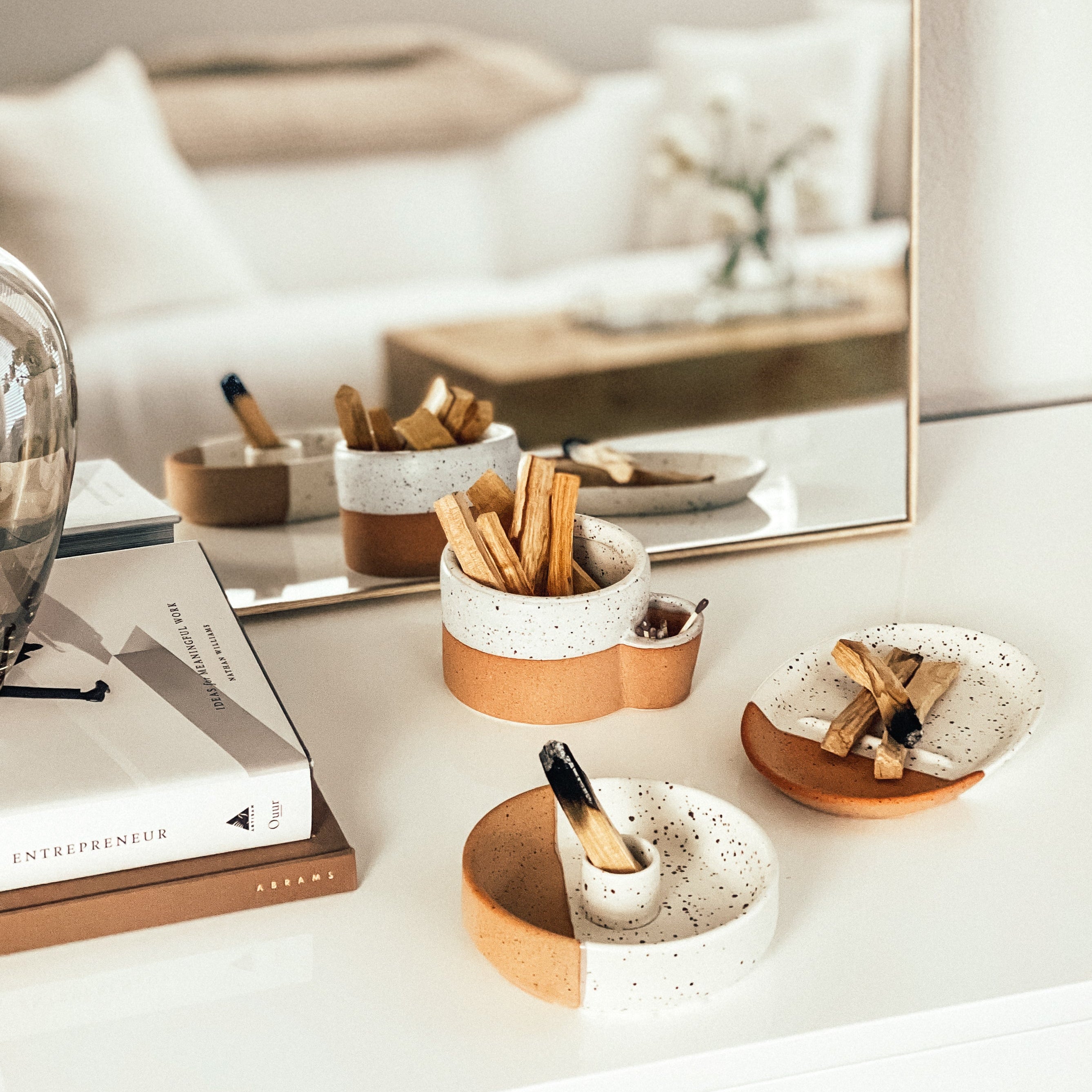 Decorative items on a white surface with a blurred background