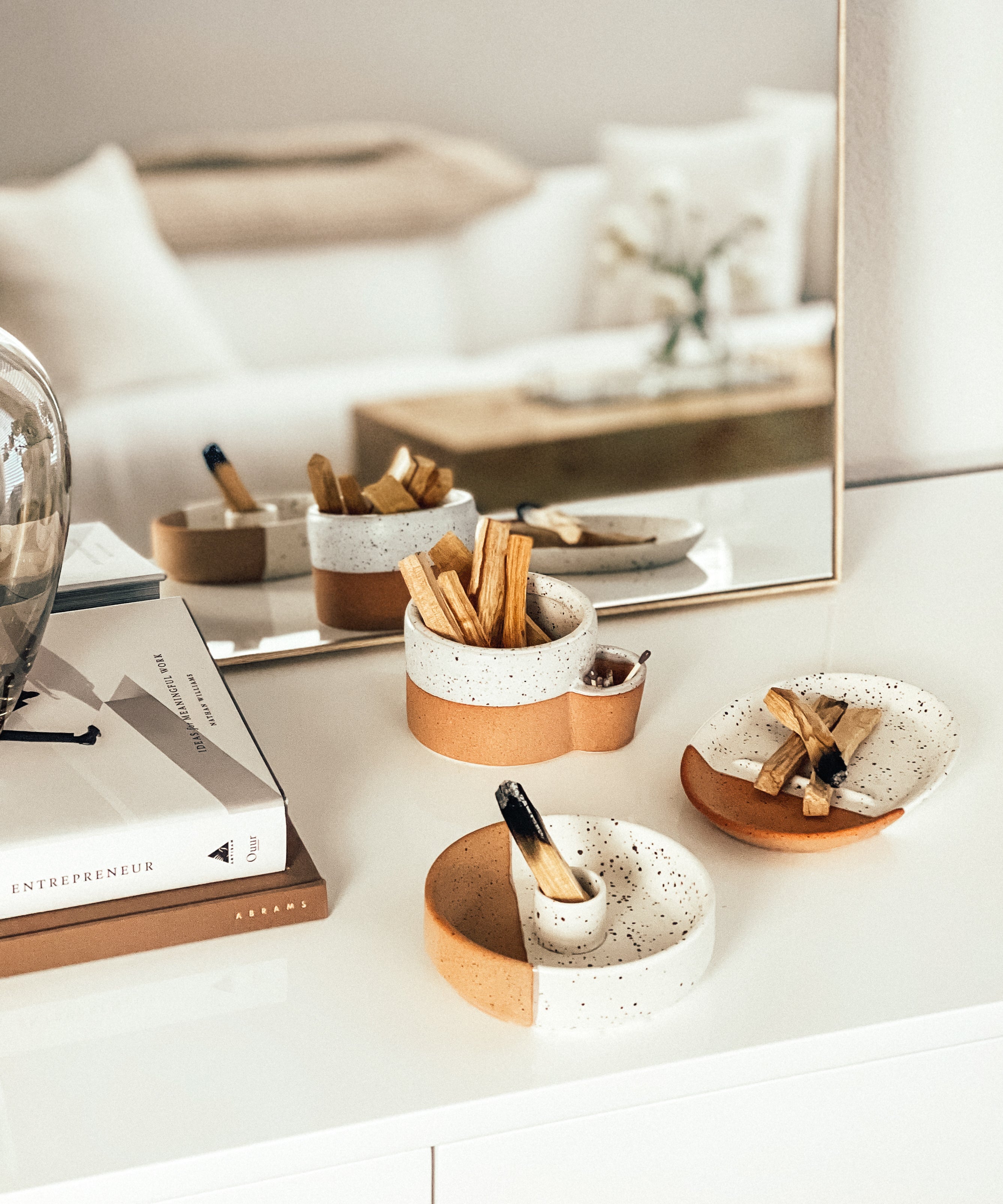Decorative items on a white surface with a blurred background