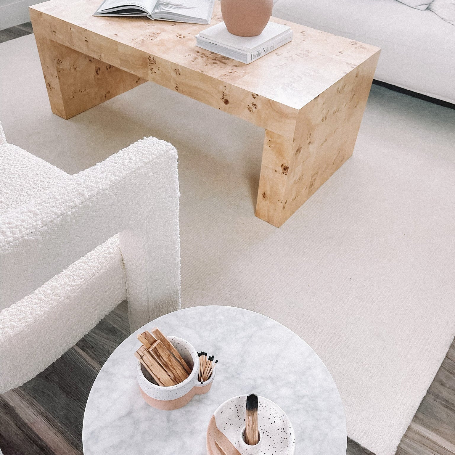 Living room with wooden coffee table and round marble table