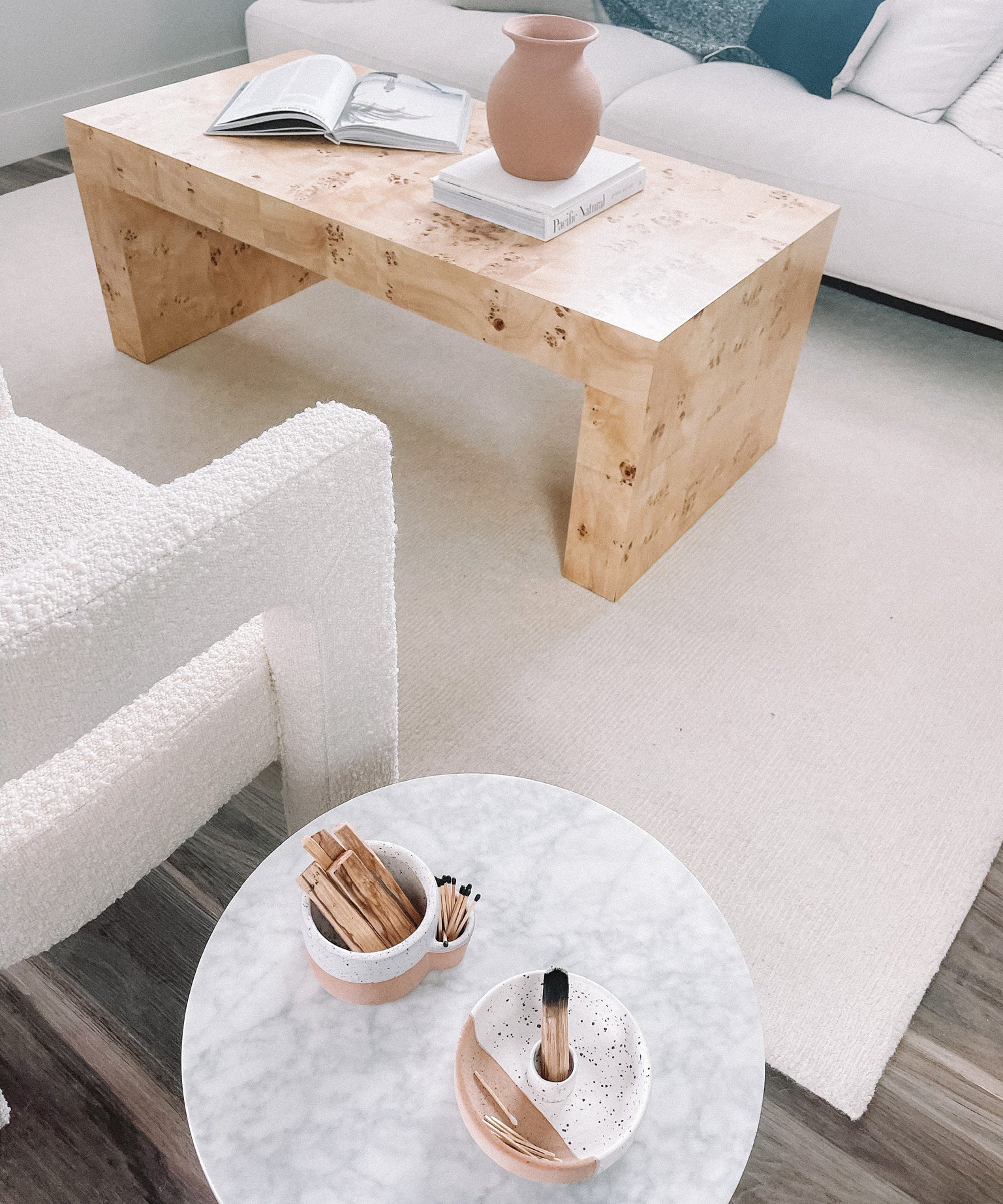 Living room with wooden coffee table and round marble table