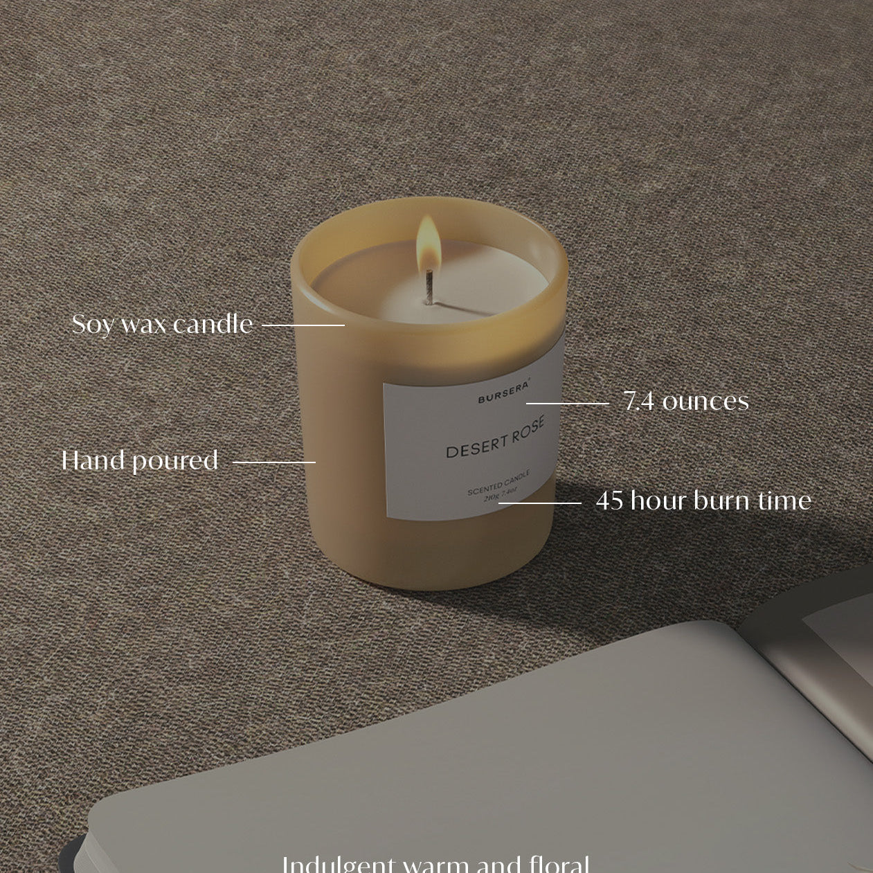 Soy wax candle with label on a textured surface