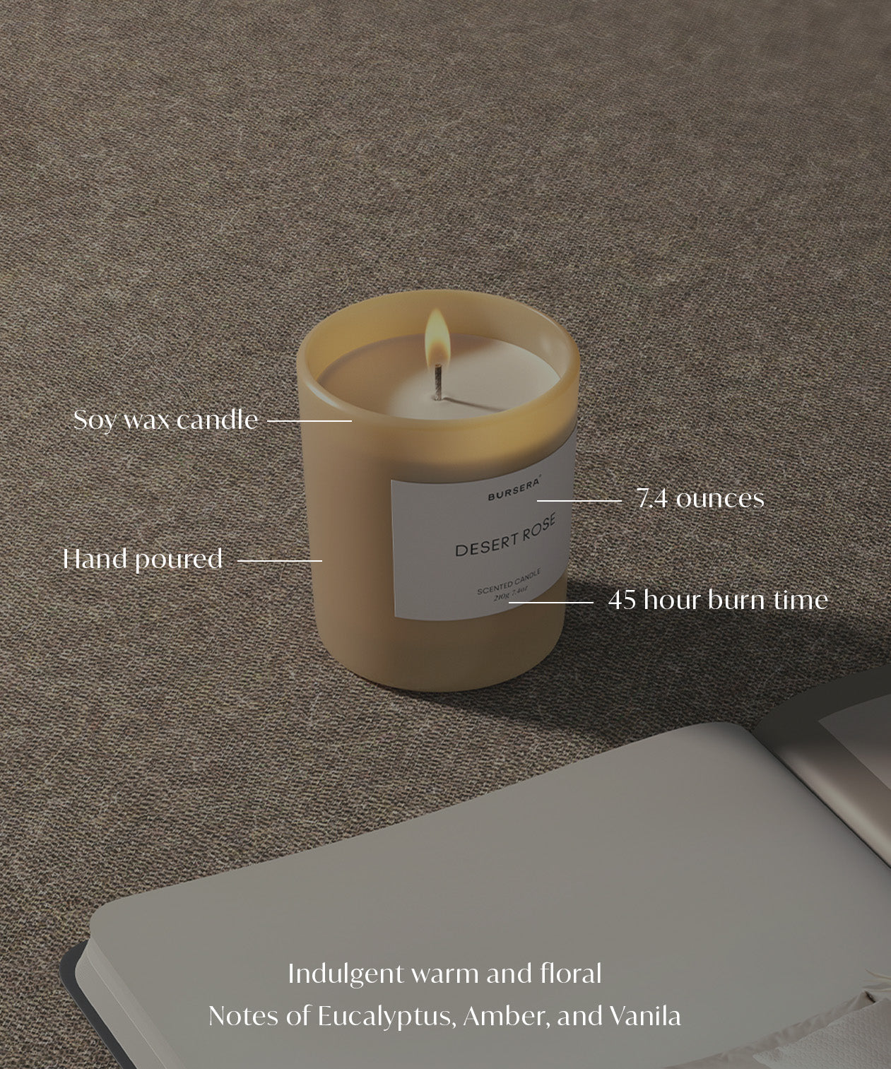 Soy wax candle with label on a textured surface