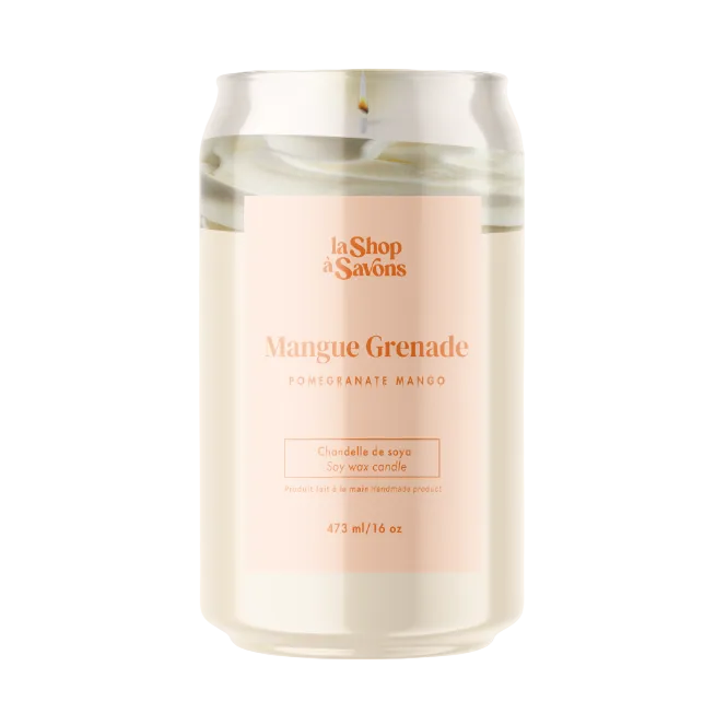 Candle in a glass jar with a pink label on a white background