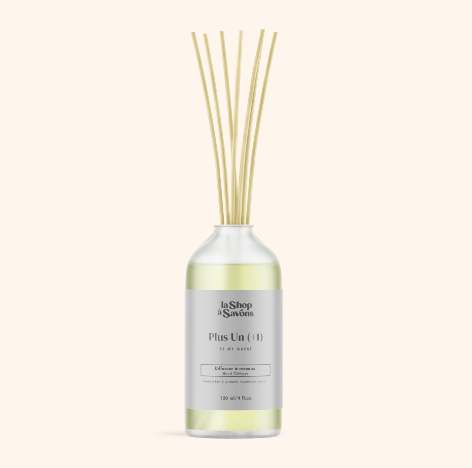 Diffuser bottle with wooden sticks on a white background