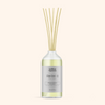 Diffuser bottle with wooden sticks on a white background