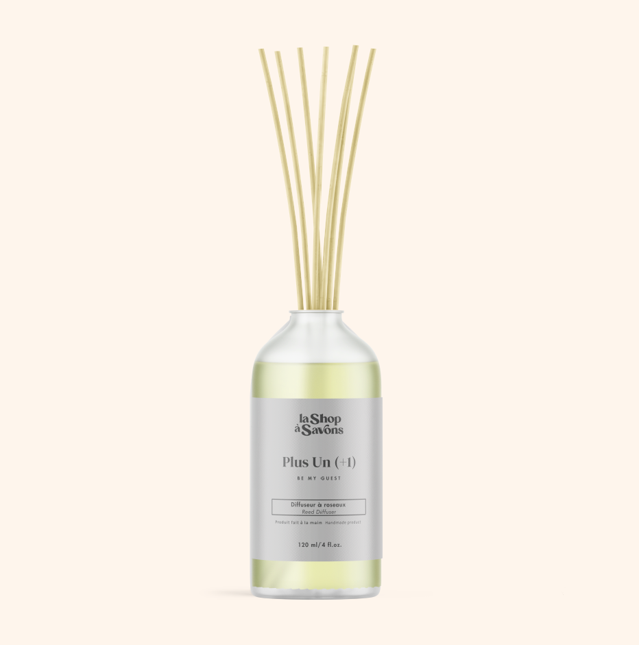 Diffuser bottle with wooden sticks on a white background