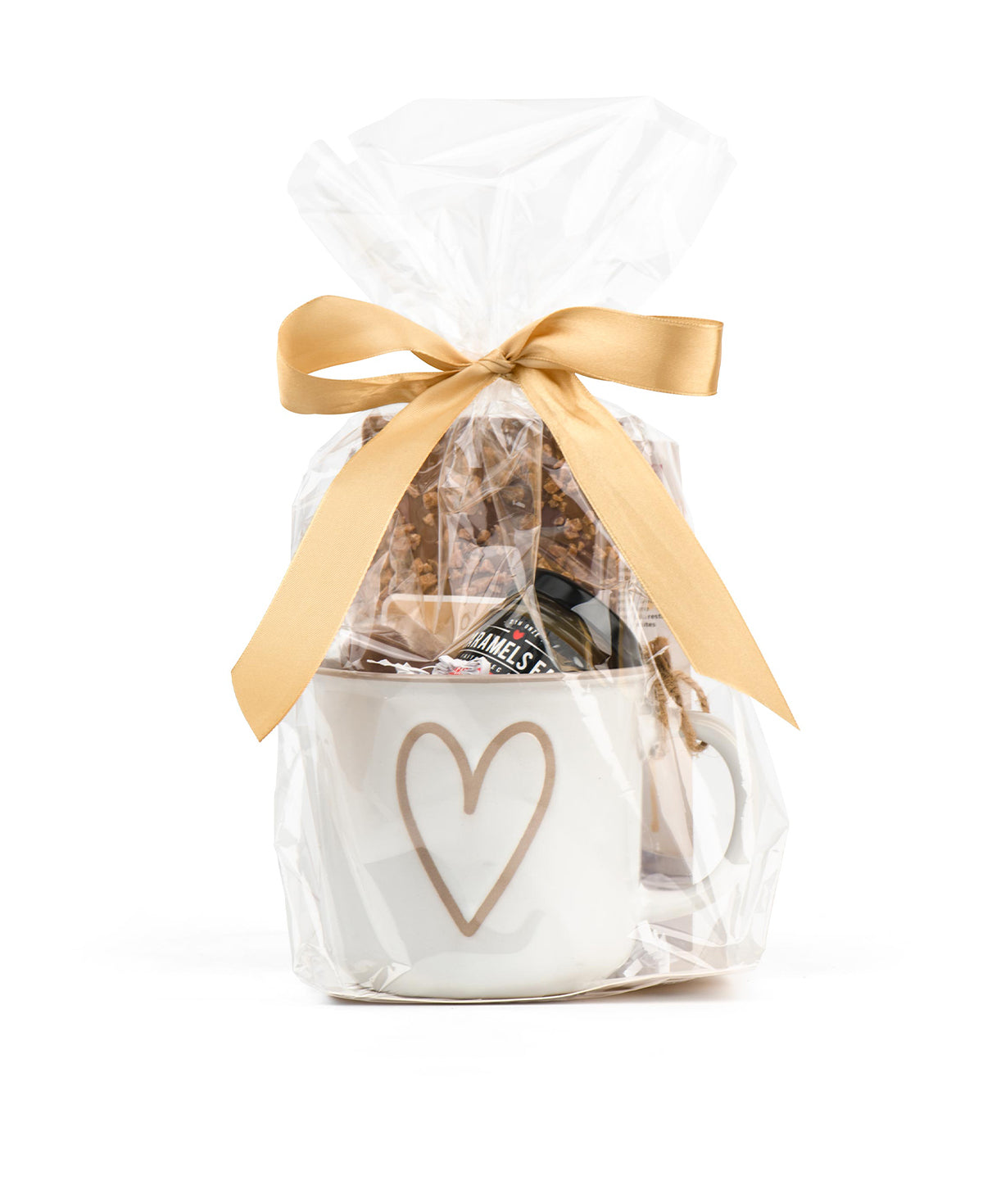 Gift basket with a white bag featuring a heart design, filled with snacks, and tied with a gold ribbon on a white background.