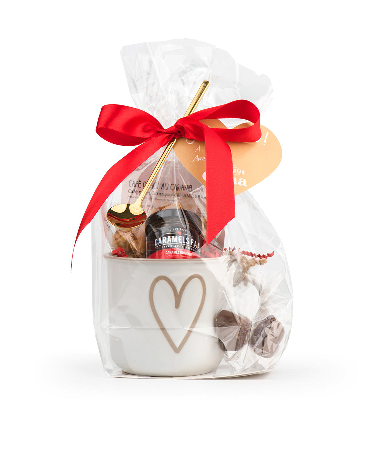 Gift set with a mug, cookies, and a red ribbon on a white background