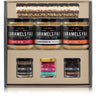 Collection of Caramels FAA jars in a display box on a white background