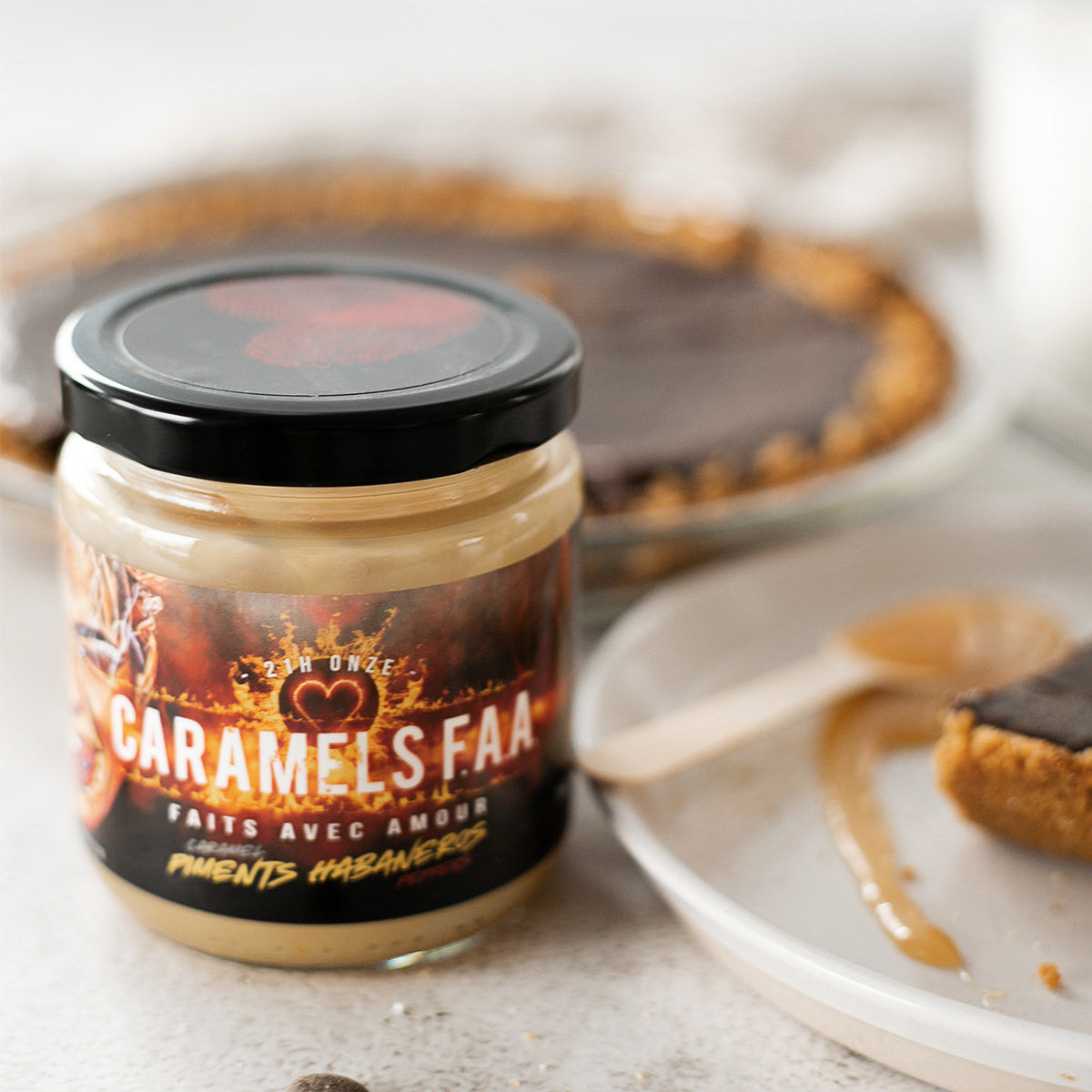 Jar of Caramels Faa with a dessert in the background