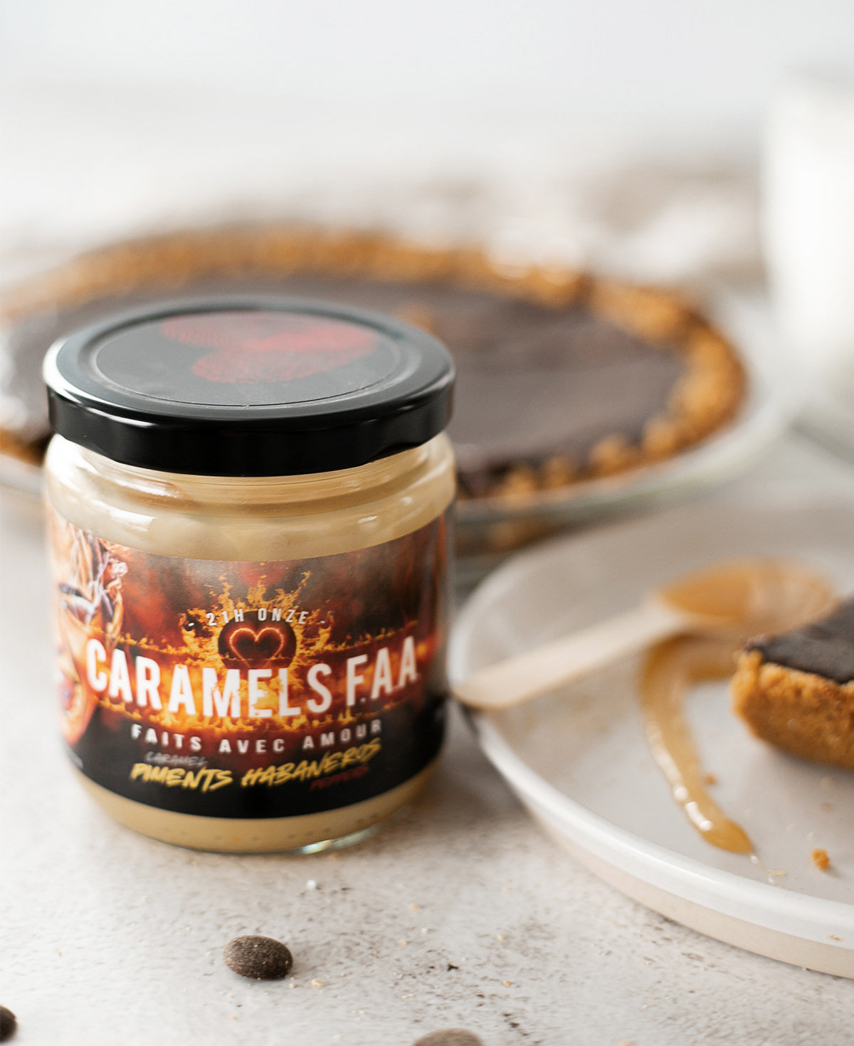 Jar of Caramels Faa with a dessert in the background