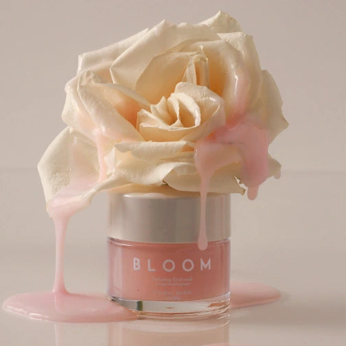 Cardea AuSet Bloom Jar with a white rose on a beige background