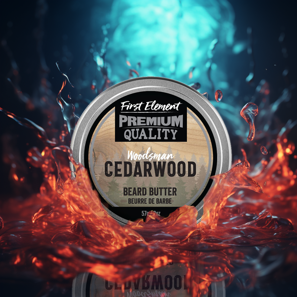 A round tin of First Element Beard Butter in the Cedarwood scent, set against a dramatic background of fiery orange embers and a glowing blue-green water splash. The tin features a silver rim and a wood-grain textured label.