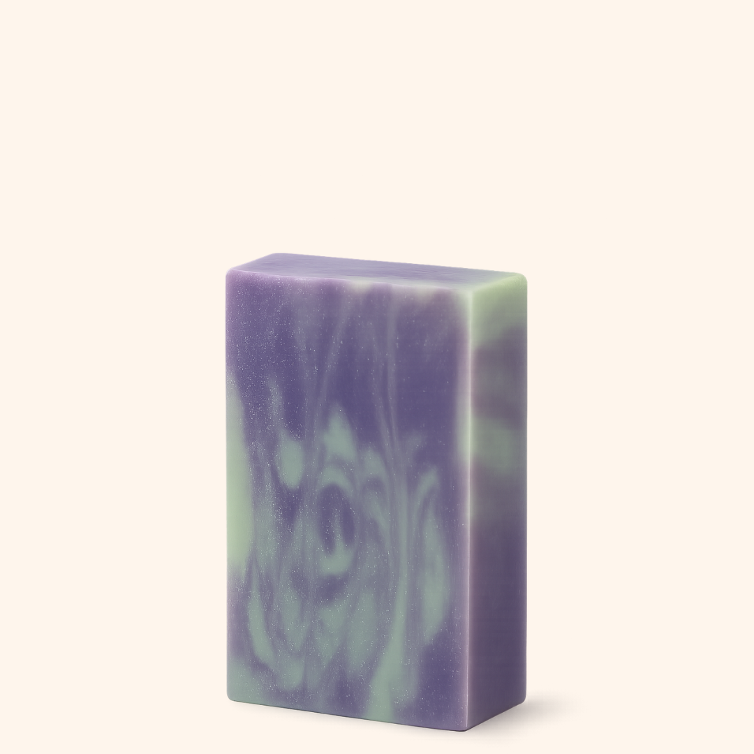 Purple and green soap bar on a white background
