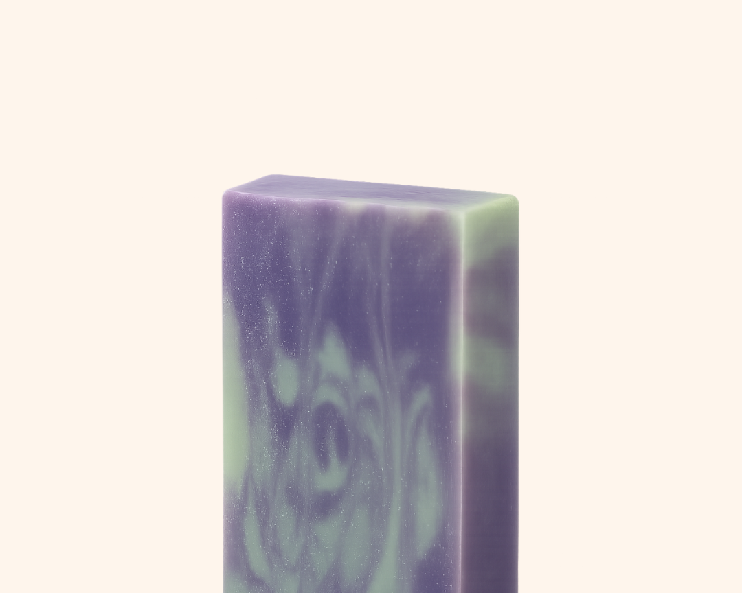 Purple and green soap bar on a white background