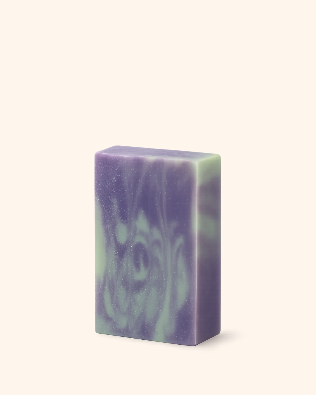Purple and green soap bar on a white background