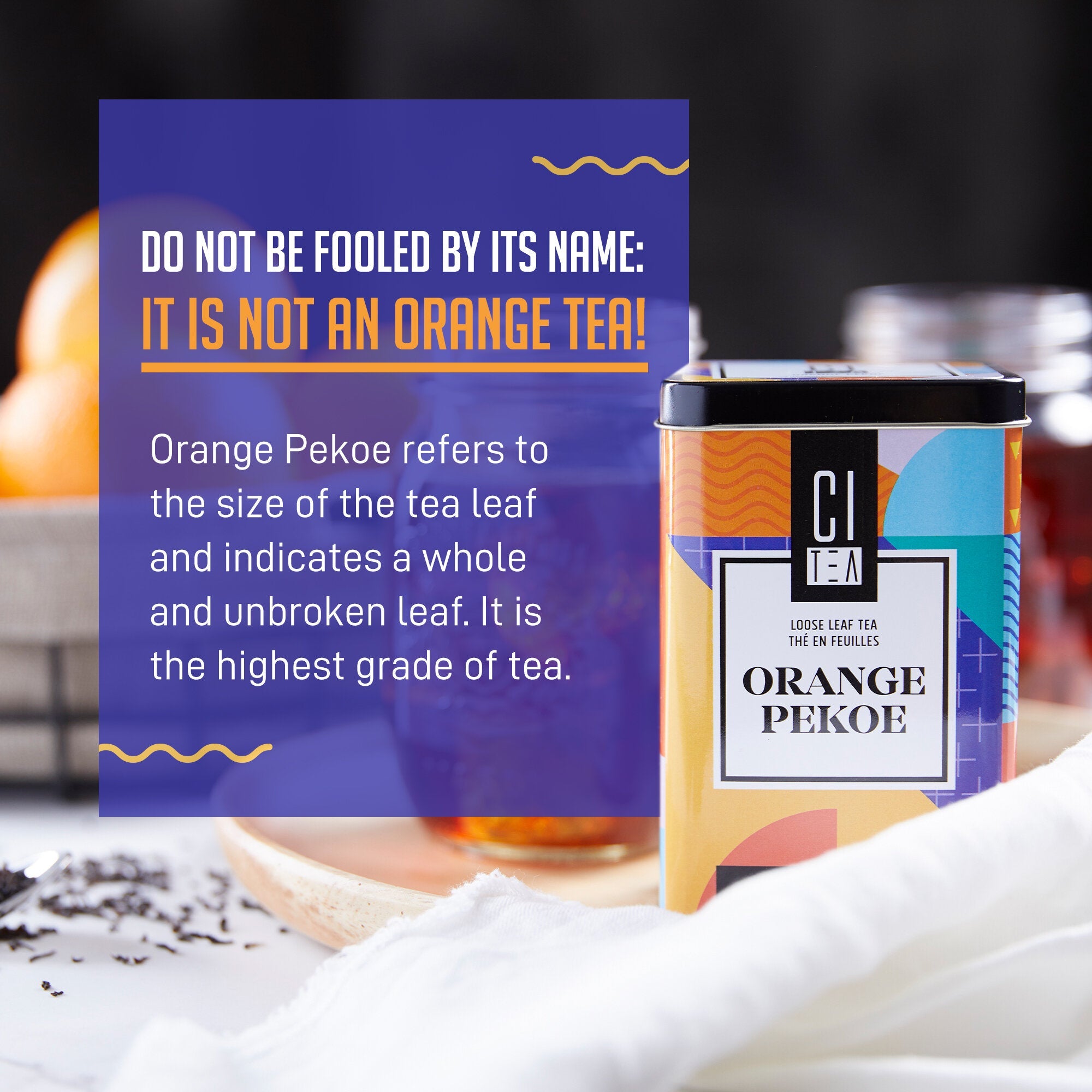 Tea canister labeled 'Orange Pekoe' with text explaining the tea type on a blurred background.