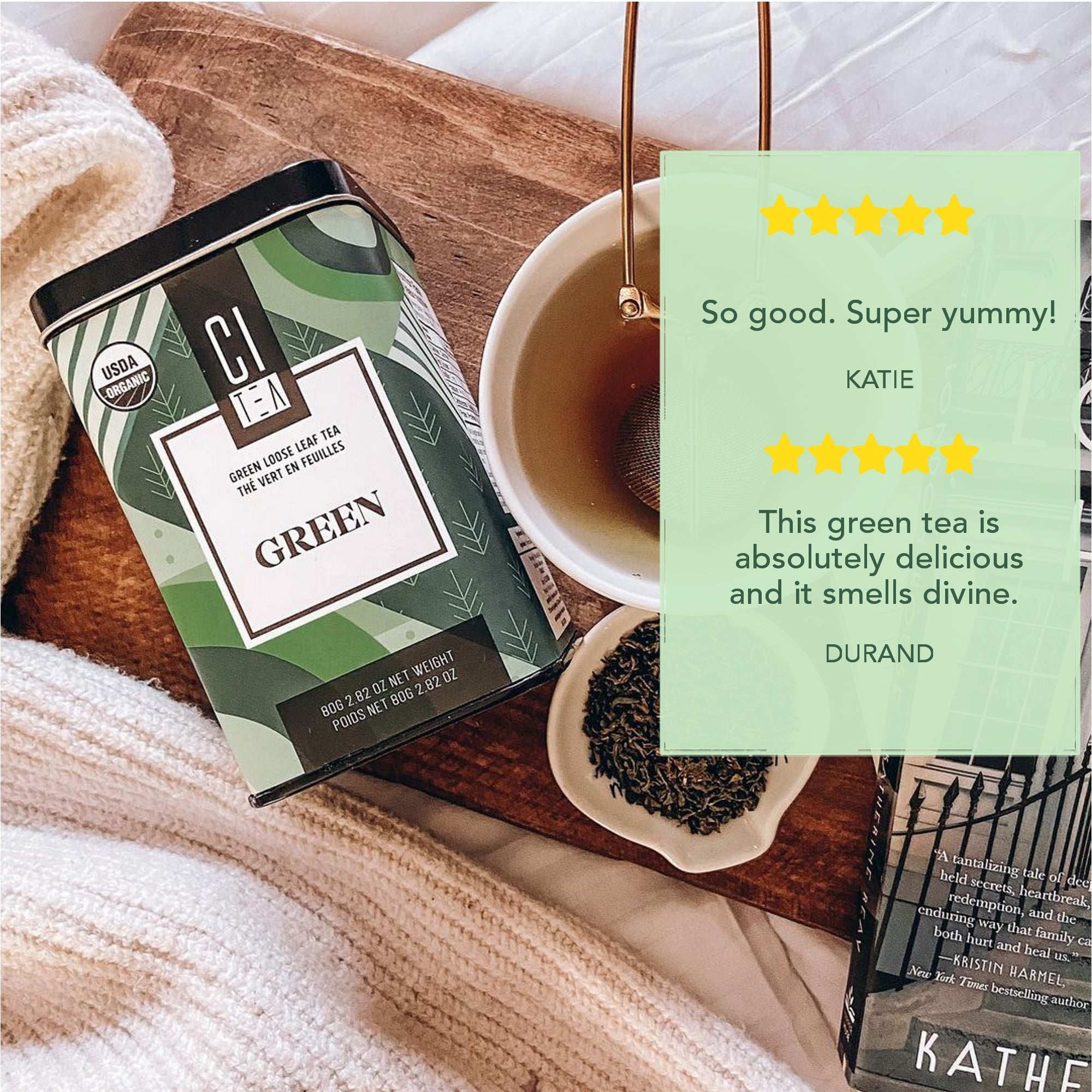 Green tea packaging with a cup of tea and positive reviews on a wooden surface.