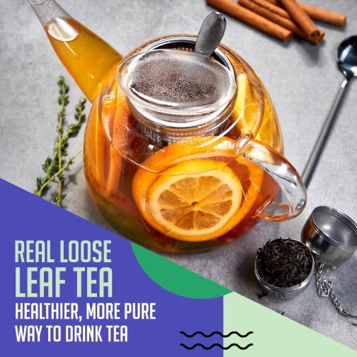 Premium loose leaf green tea brewed in glass teapot