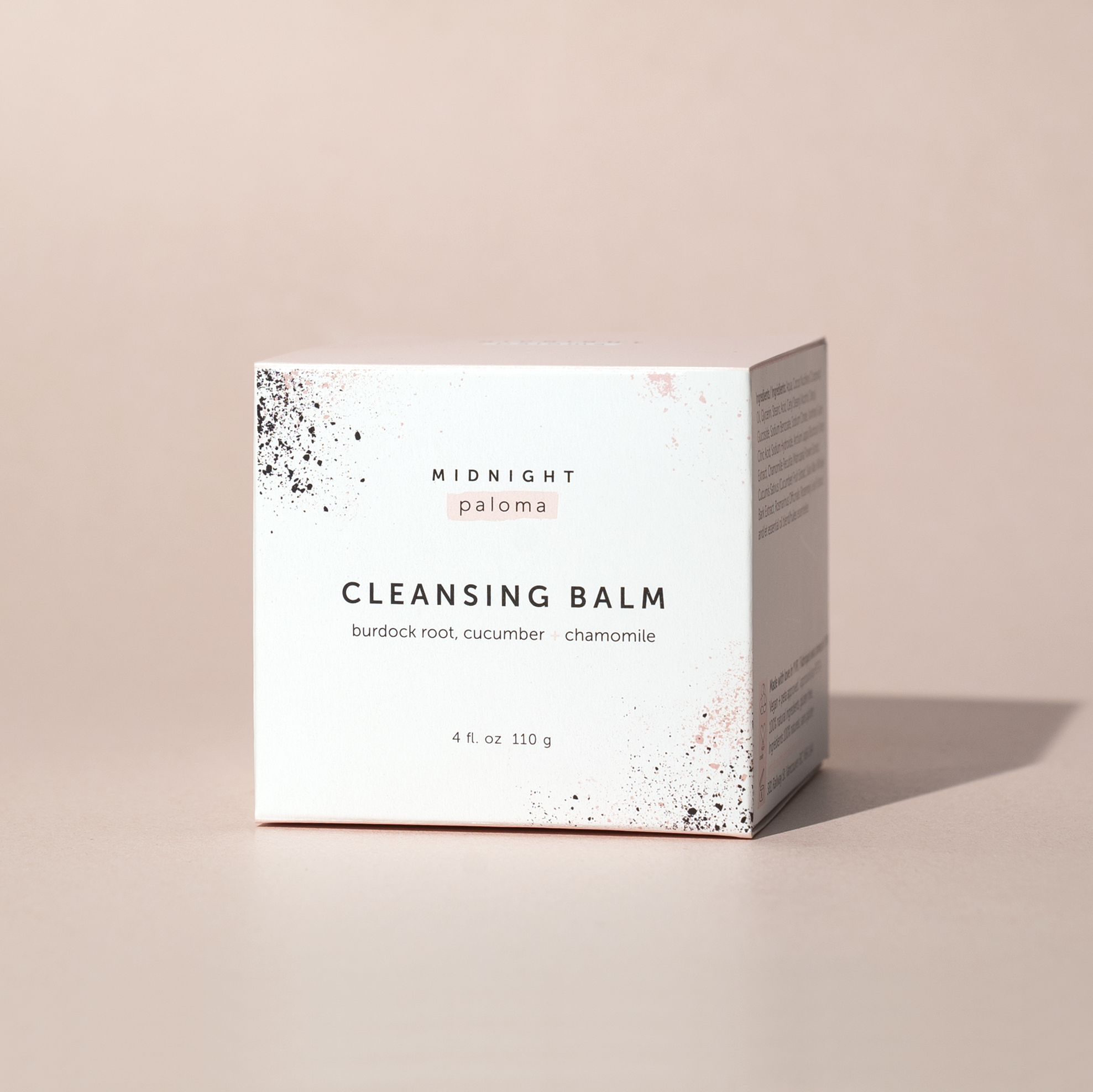 Cleansing balm packaging with 'Midnight Paloma' branding on a beige background