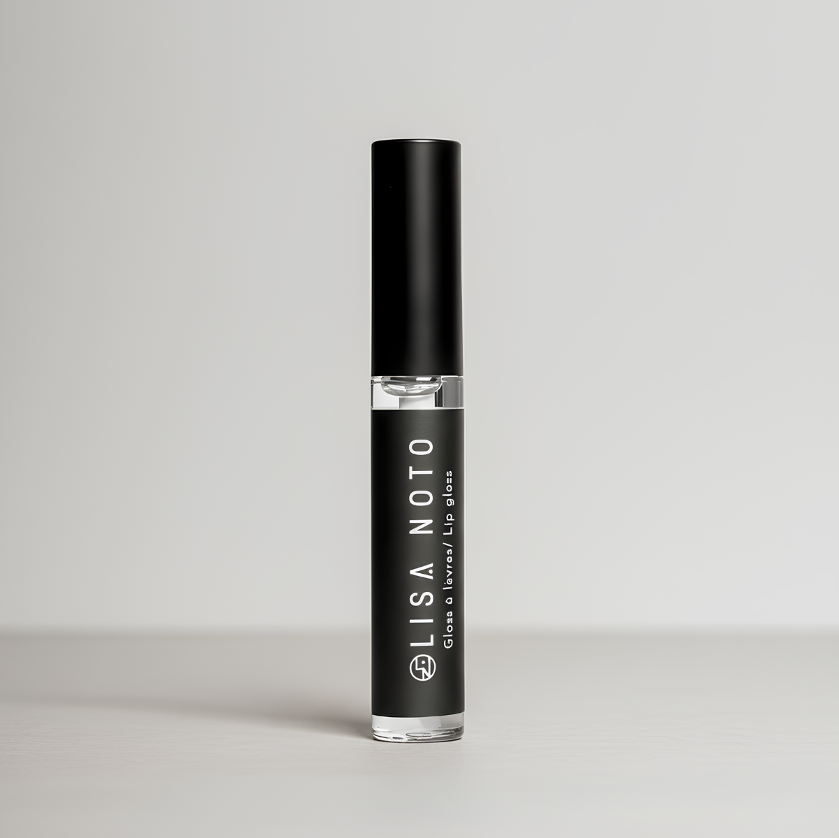 Black lip gloss bottle with 'LISA NOTO' branding on a gray background