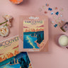 Vancouver-themed puzzle box with scattered puzzle pieces on a pink surface.