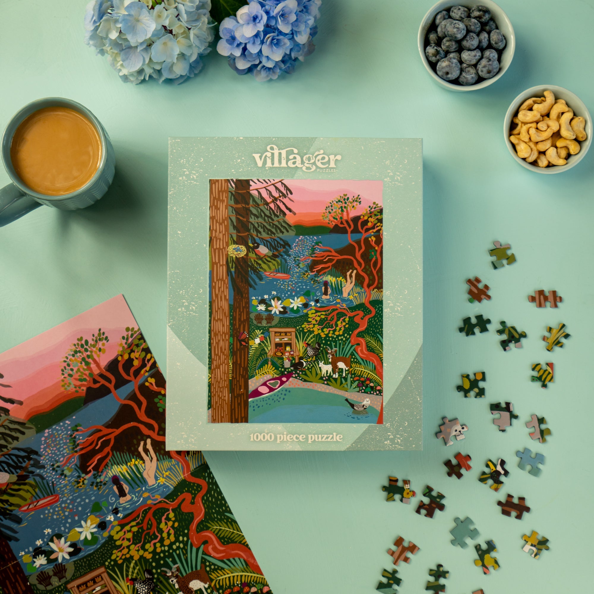 Villager puzzle box with puzzle pieces and coffee on a light blue surface