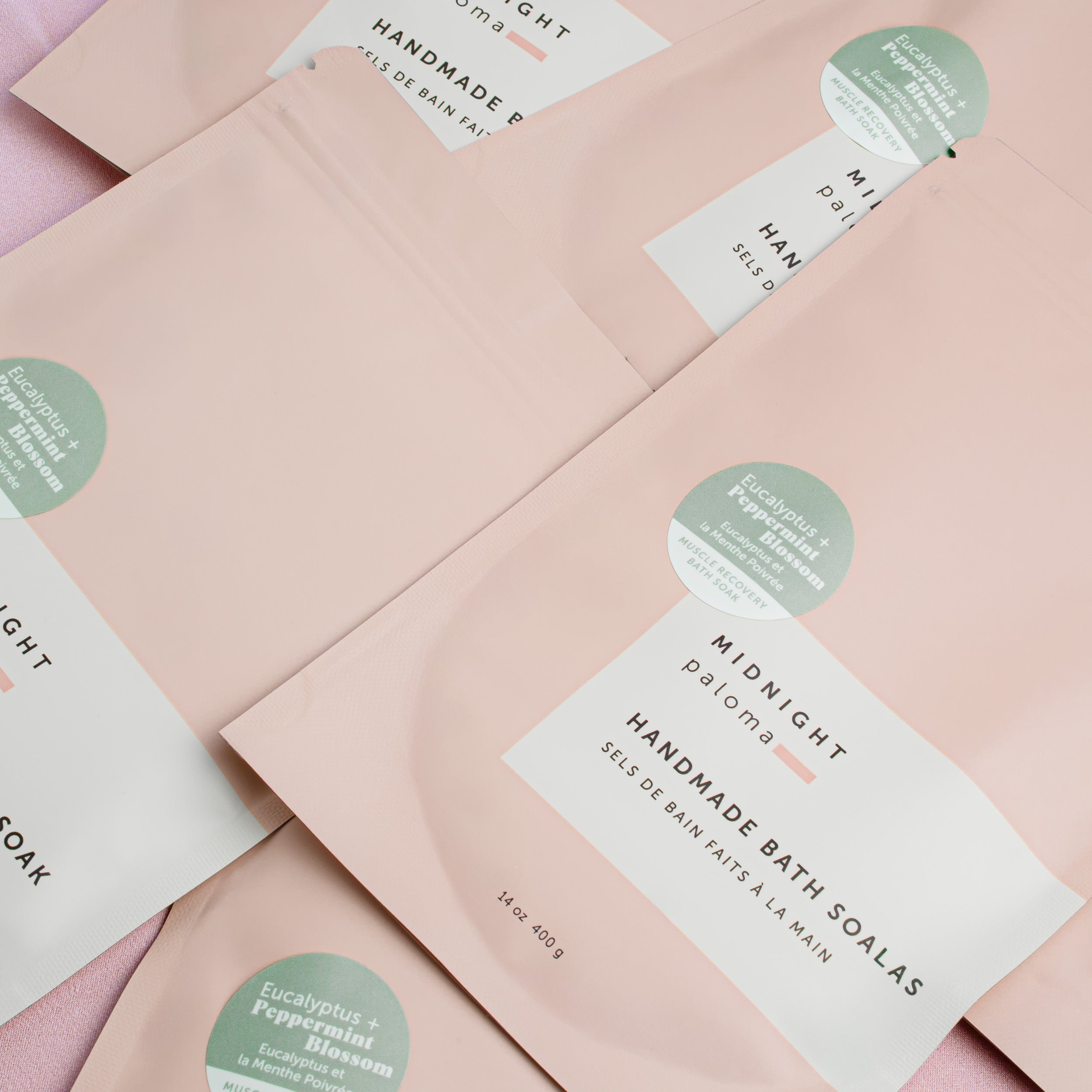 Bath soak with labels on a pink background
