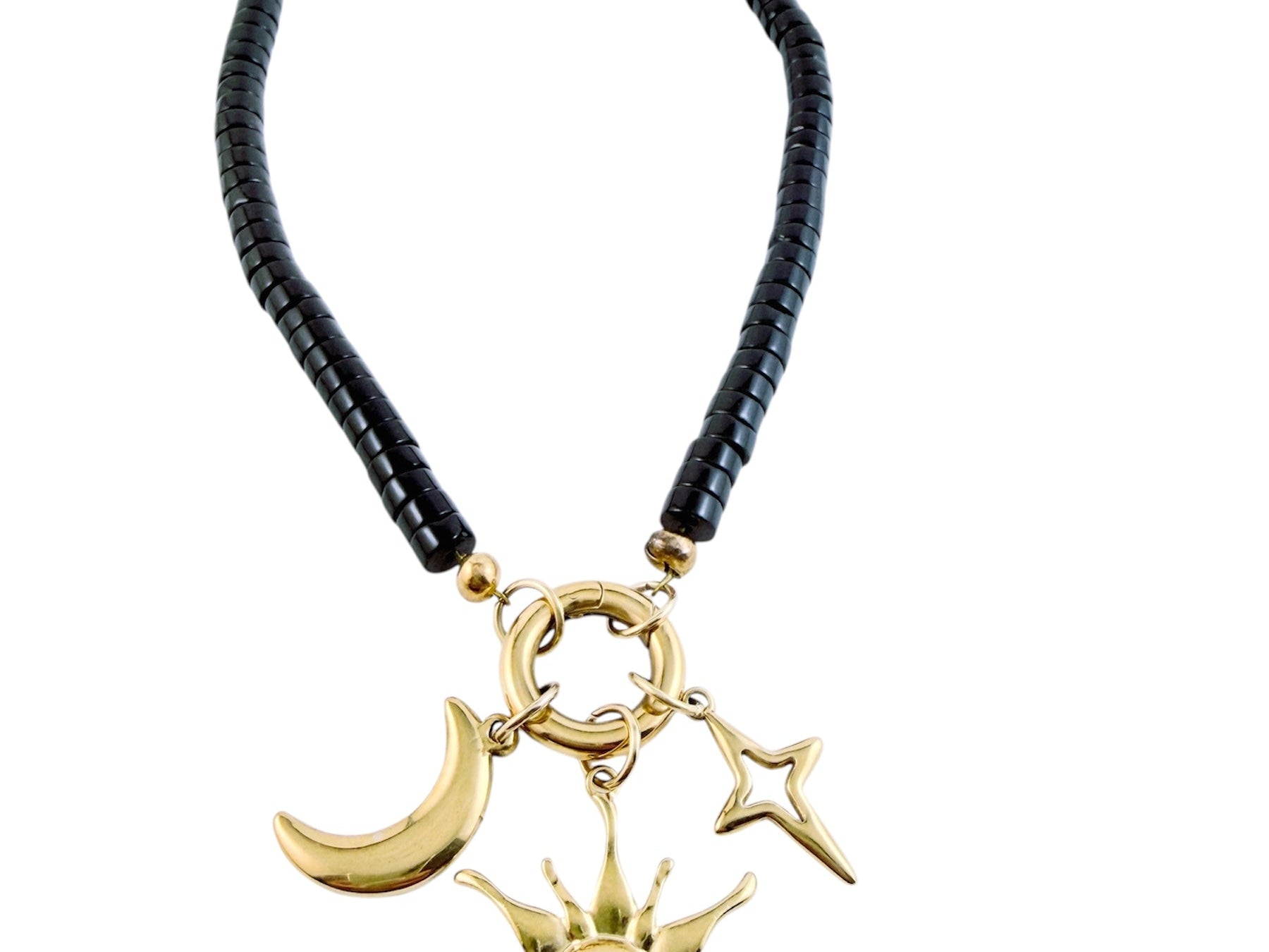 Moonrise Necklace - Onyx with gold sun, moon, and star charms on a black beaded chain against a white background