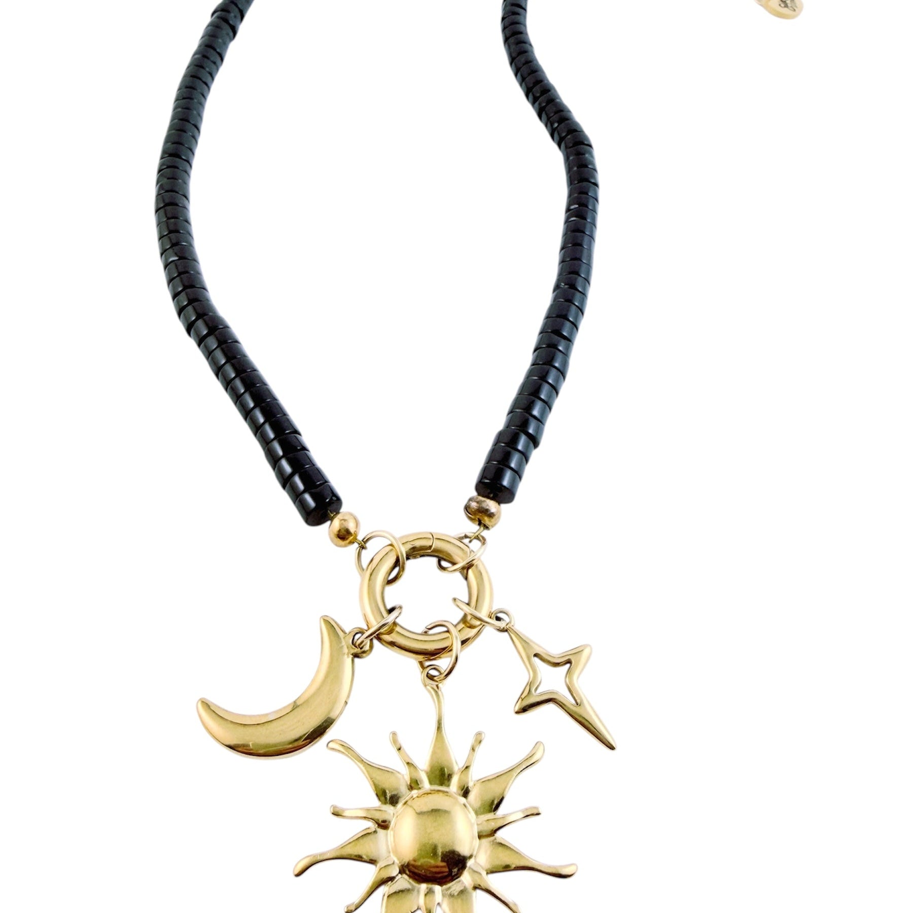 Moonrise Necklace - Onyx with gold sun, moon, and star charms on a black beaded chain against a white background