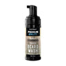A bottle of First Element Beard Wash in Cedarwood scent, featuring a black pump dispenser and a label with a rustic wood-grain pattern on a white background.