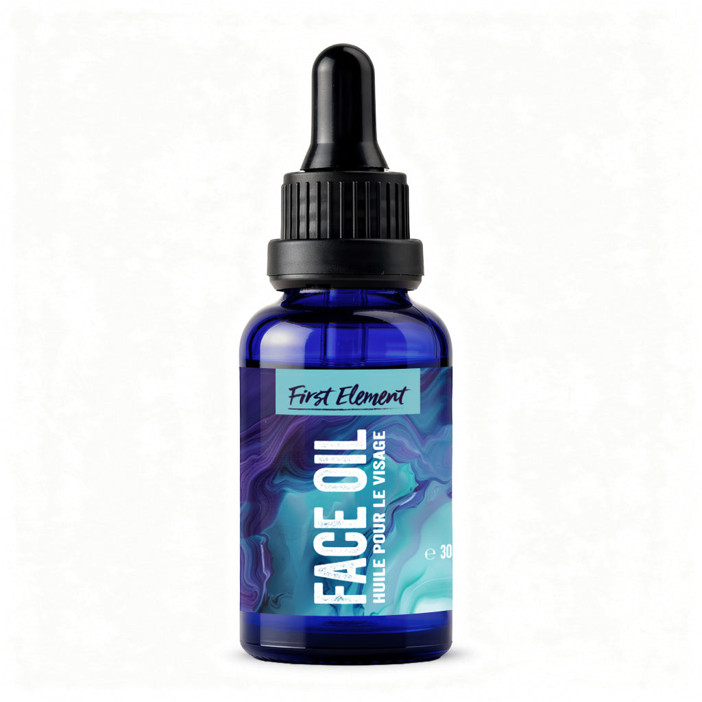 Blue bottle of face oil with dropper labeled 'First Element' on a white background