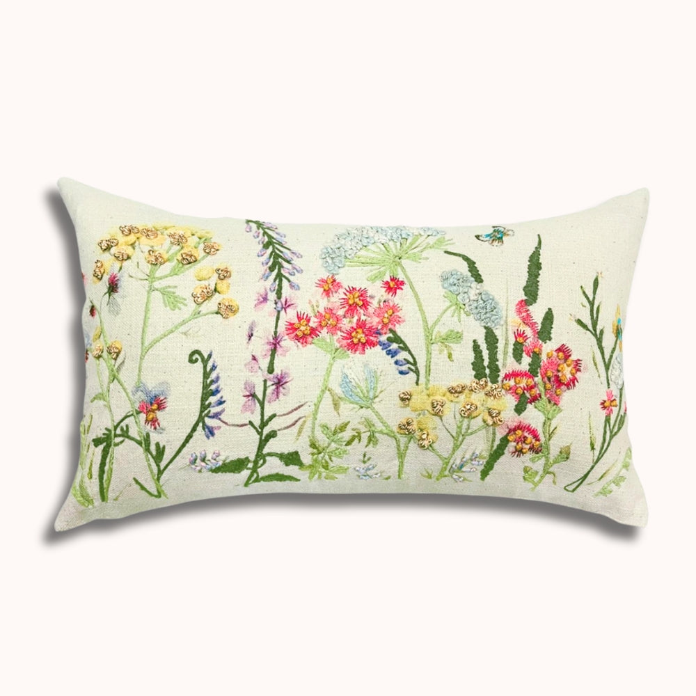 Decorative pillow with floral pattern on a white background