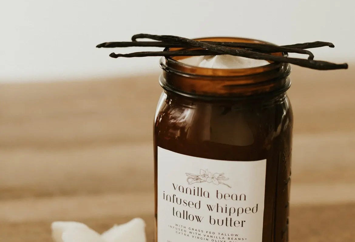 Vanilla bean infused whipped butter in an amber jar on a wooden surface