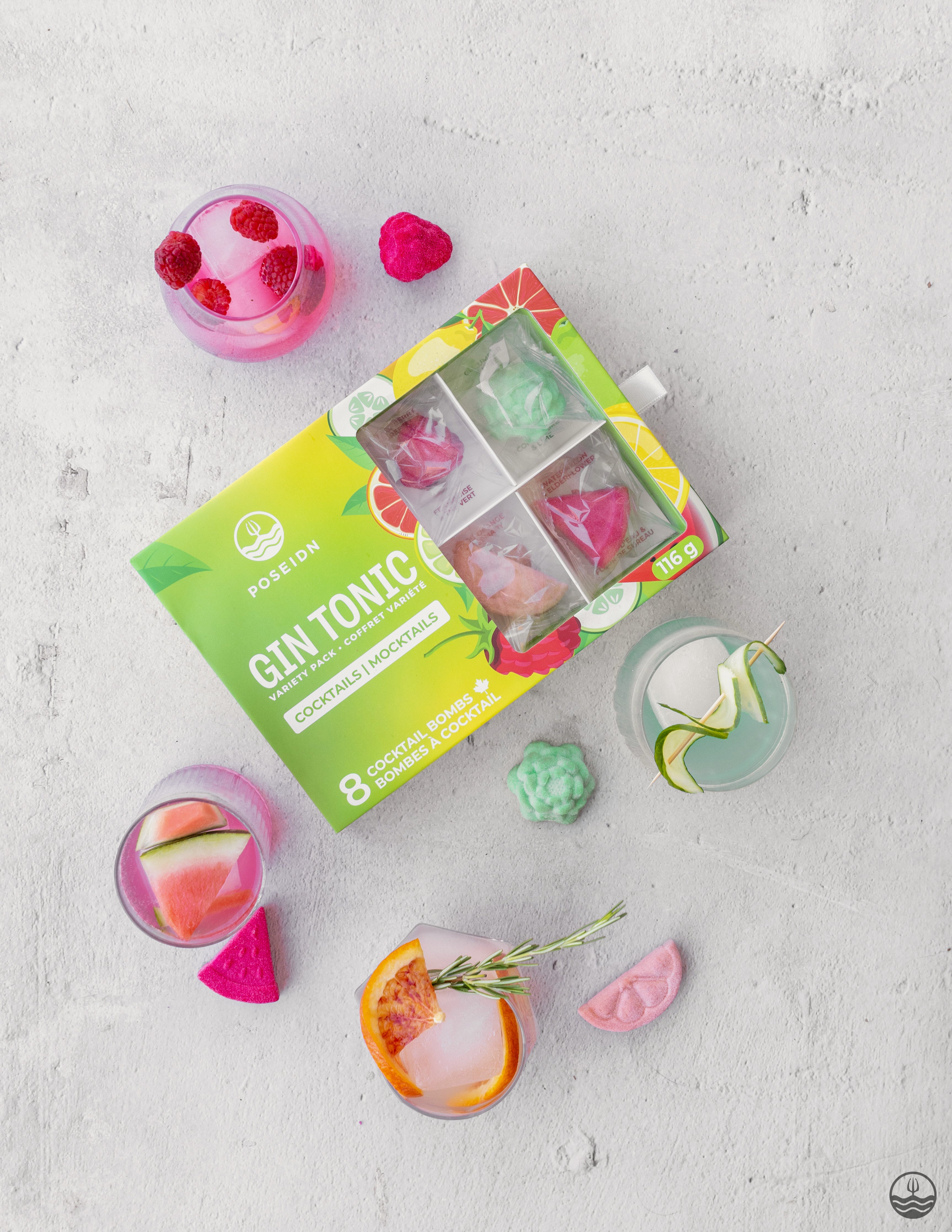 Gin tonic ice cube tray with colorful ice cubes on a light gray surface
