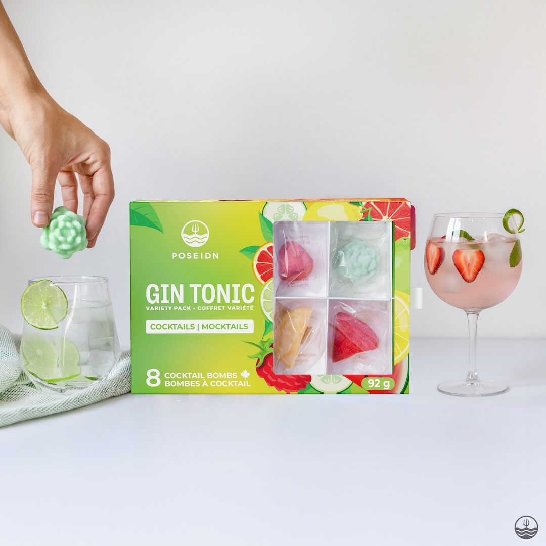 Box of Poseidon Gin Tonic cocktail bombs with two glasses and a hand holding a bomb.