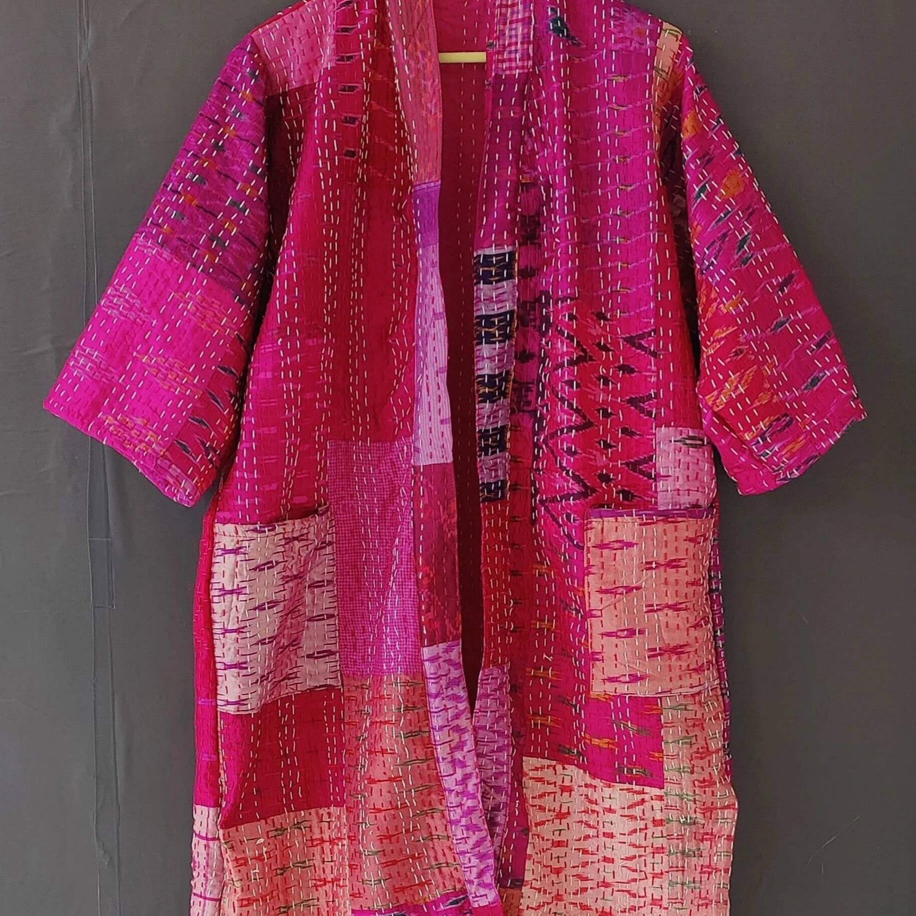 Handmade Kantha quilted kimono bathrobe in vibrant pink hues, made from organic cotton and perfect for layering.