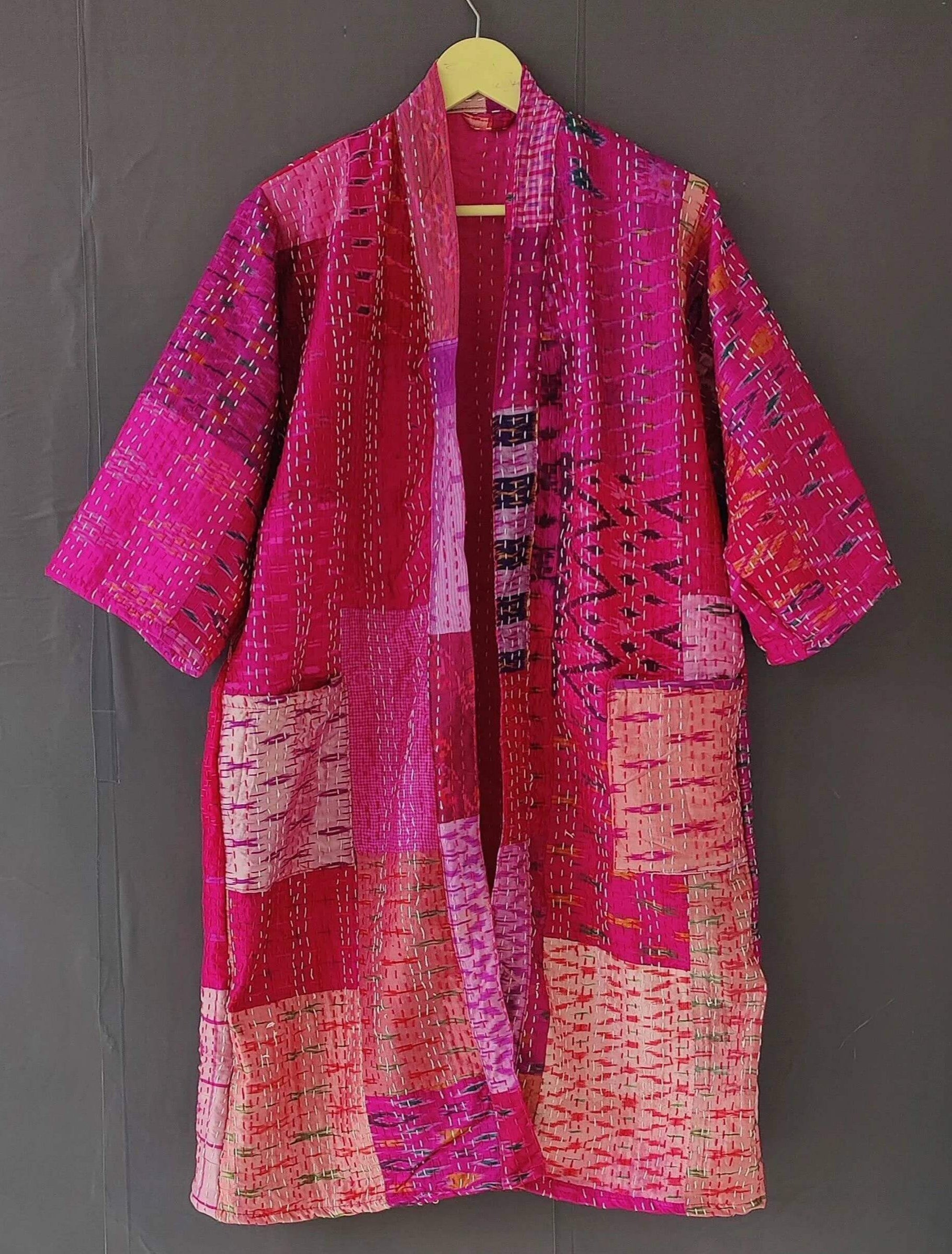 Handmade Kantha quilted kimono bathrobe in vibrant pink hues, made from organic cotton and perfect for layering.
