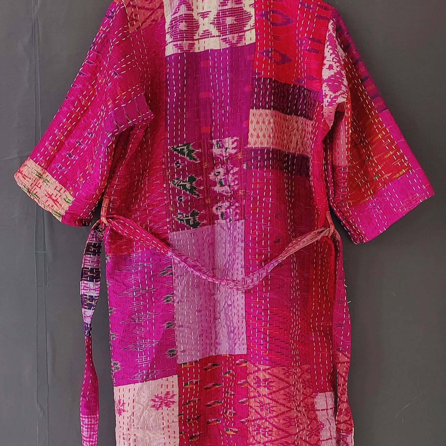 Handmade Kantha quilted kimono bathrobe in vibrant pink, crafted from organic cotton. Versatile and stylish layering piece.