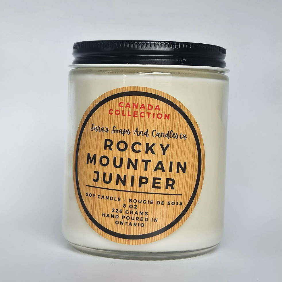 Candle jar labeled 'Rocky Mountain Juniper' from Canada Collection on a light gray background