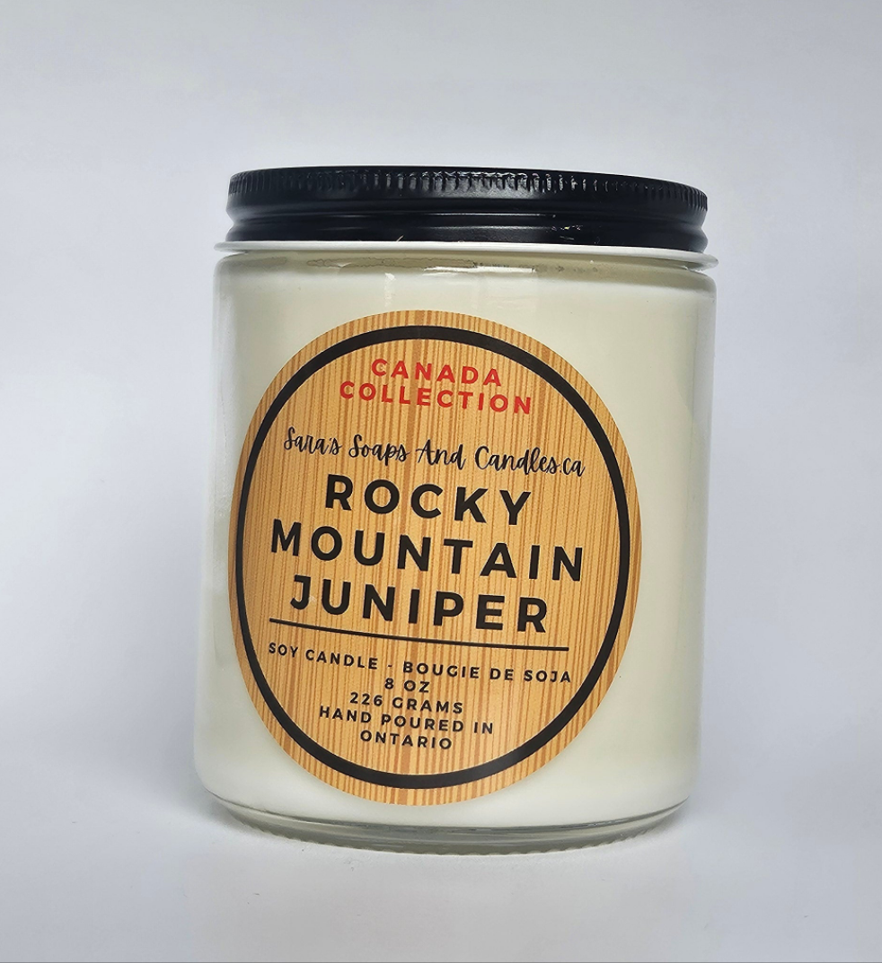 Candle jar labeled 'Rocky Mountain Juniper' from Canada Collection on a light gray background